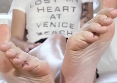 Footfetish trans babe displays us her long feet