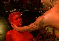 Babe colored in red fucked by tranny